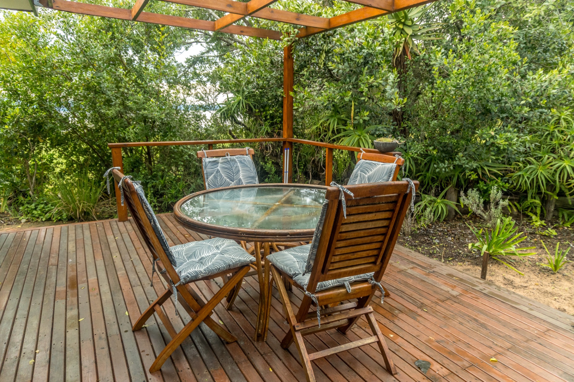 Private garden deck and play area at Loerie Chalet