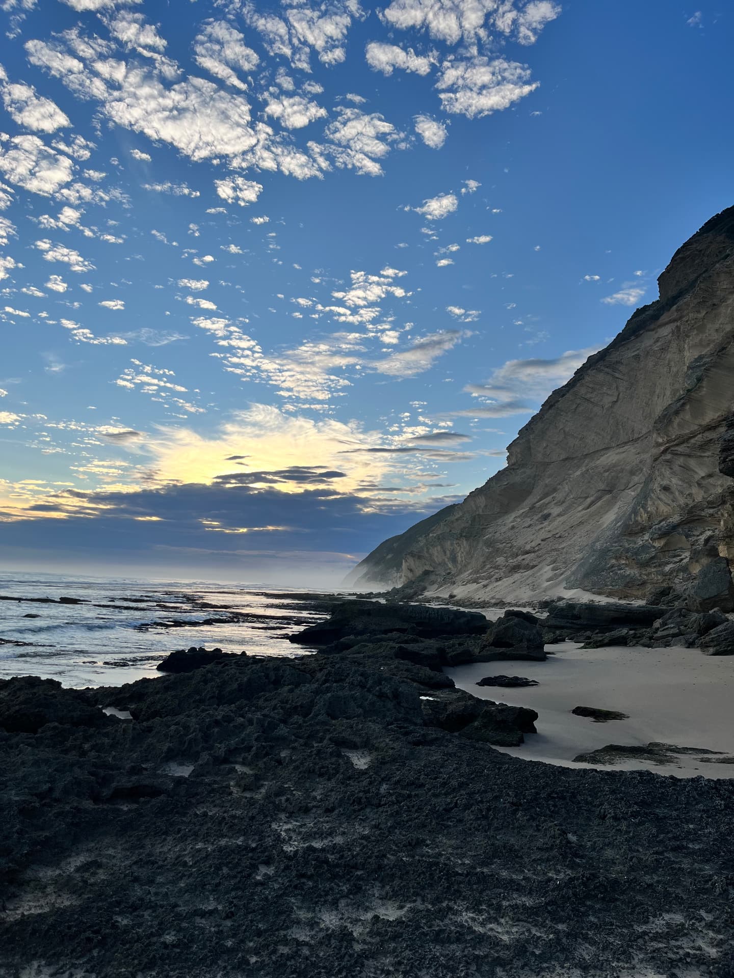Sandstone cliffs and rock pools at dawn on the Garden Route coast