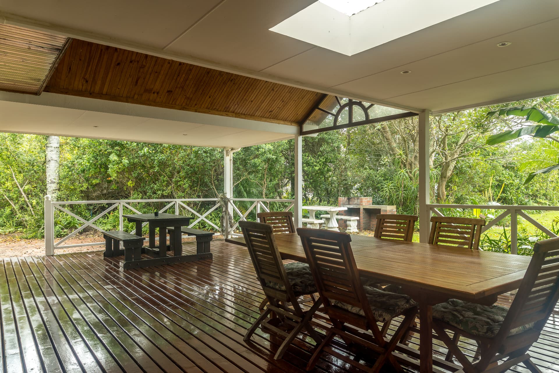 Covered patio with outdoor dining and braai area at Fish Eagle chalet
